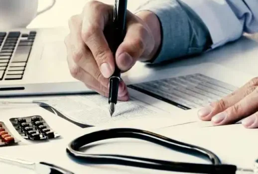 midsection-doctor-reading-paper-table-clinic-2-1 midsection-doctor-reading-paper-table-clinic-2-1